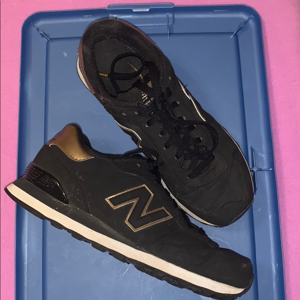 new balance black and gold tennis shoes